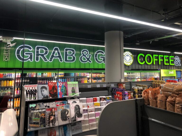 Illuminated Grab & Go and Coffee bulkhead signage inside a convenience store